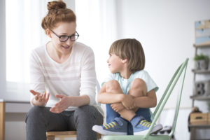 Mother talking to smiling son