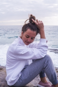 Photo of Woman Sitting on Shore