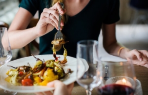 Woman in Black Crew-neck Top in Front of Table